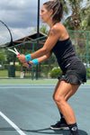 Neptune Athletics tennis player in black tennis skirt