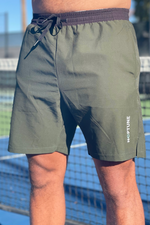 Neptune Athletics forest green mens shorts for tennis, gym, cross-training, with NEPTUNE vertical on left leg