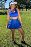 Neptune sports bra - blue with white trident and Ulysses royal blue challenge tennis skirt